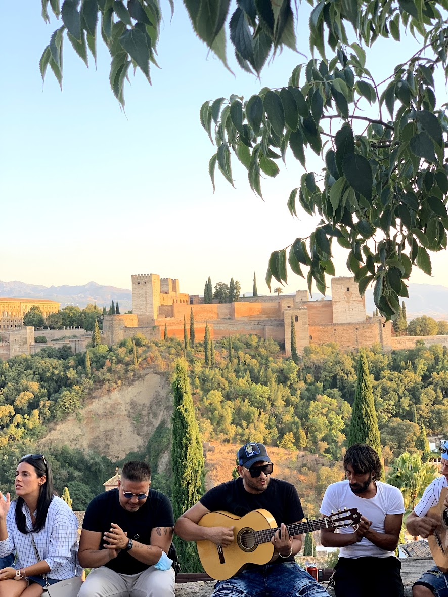 southern Spain Alhambra with Spanish guitar players under a tree